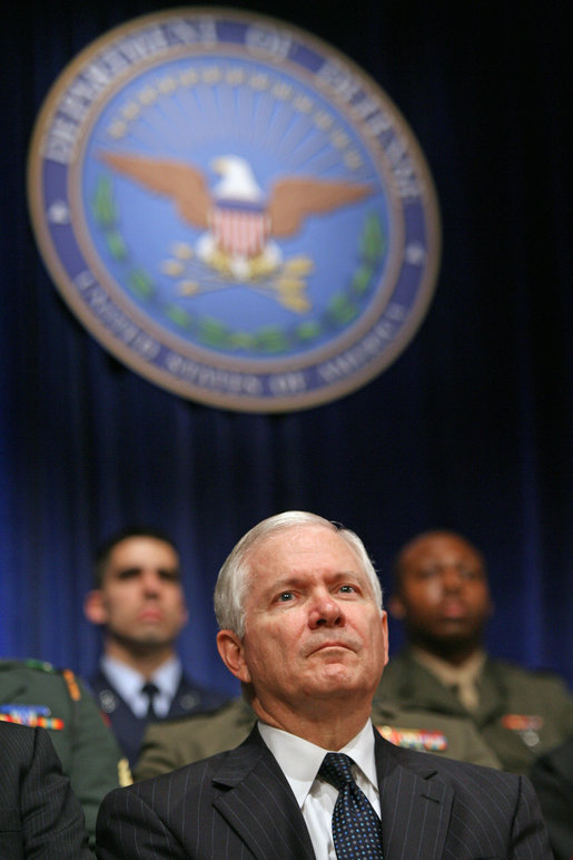 Robert Gates listens to President George W. Bush speak during his swearing-in ceremony as Secretary of Defense at the Pentagon Monday, Dec. 18, 2006. White House photo by Eric Draper