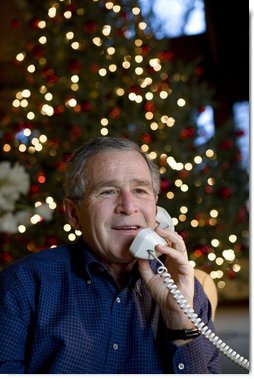 President George W. Bush makes Christmas Eve telephone calls to members of the Armed Forces at Camp David, Sunday, Dec. 24, 2006.  White House photo by Eric Draper