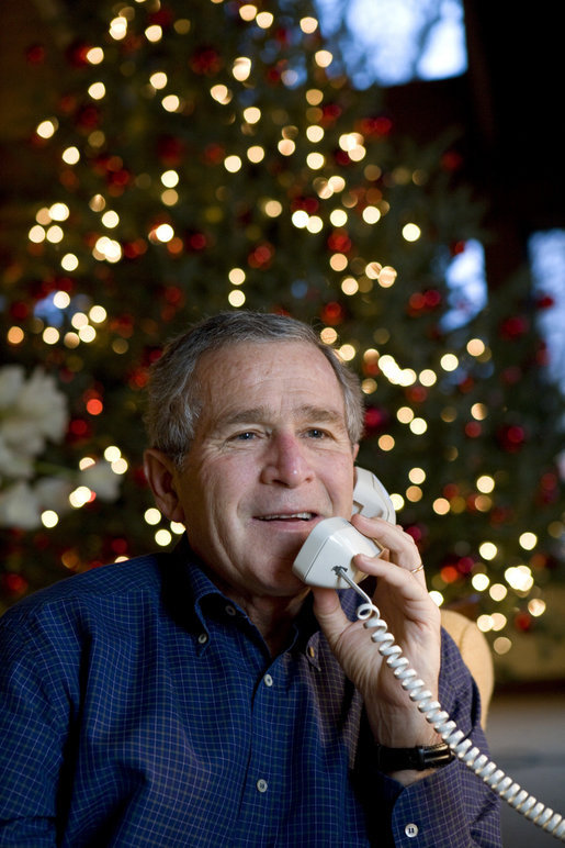 President George W. Bush makes Christmas Eve telephone calls to members of the Armed Forces at Camp David, Sunday, Dec. 24, 2006. White House photo by Eric Draper