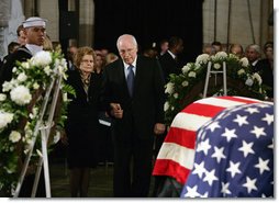 Vice President Dick Cheney holds the hand of former first lady Betty Ford as they stand before the casket of former President Gerald R. Ford during the State Funeral ceremony in the Capitol Rotunda on Capitol Hill, Saturday, December 30, 2006.  White House photo by David Bohrer