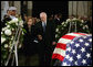Vice President Dick Cheney holds the hand of former first lady Betty Ford as they stand before the casket of former President Gerald R. Ford during the State Funeral ceremony in the Capitol Rotunda on Capitol Hill, Saturday, December 30, 2006. White House photo by David Bohrer