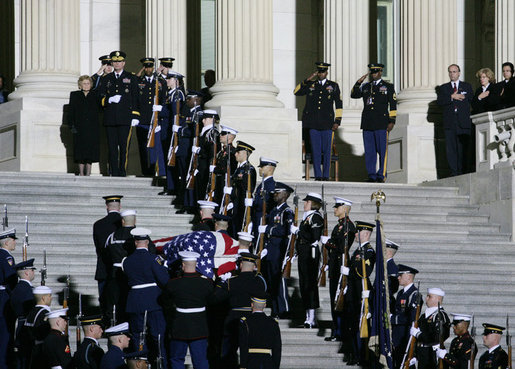 Former first lady Betty Ford stands at the top of the East Steps of the U.S. Capitol as military pallbearers carry the casket of former President Gerald R. Ford up the steps of the U.S. Capitol, Saturday evening, Dec. 30, 2006 in Washington, D.C., to the State Funeral ceremony in the Capitol Rotunda. White House photo by Shealah Craighead