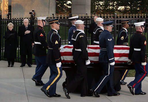 Vice President Dick Cheney and Mrs. Lynne Cheney salute as the casket of former President Gerald R. Ford is carried by a military honor guard during interment ceremonies on the grounds of the Gerald R. Ford Presidential Museum in Grand Rapids, Mich., Wednesday, January 3, 2007. White House photo by David Bohrer