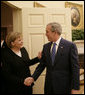 President George W. Bush welcomes German Chancellor Angela Merkel to the Oval Office, Thursday, Jan. 4, 2006, at the White House. White House photo by Eric Draper