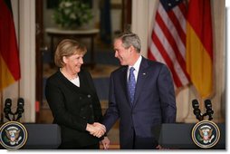 President George W. Bush and German Chancellor Angela Merkel shake hands at the conclusion of their joint news conference at the White House, Thursday, Jan. 4, 2006. White House photo by Paul Morse