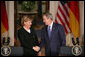 President George W. Bush and German Chancellor Angela Merkel shake hands at the conclusion of their joint news conference at the White House, Thursday, Jan. 4, 2006. White House photo by Paul Morse