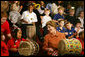 Mrs. Laura Bush joins in a musical number playing a drum with children at the Louisiana Children’s Museum in New Orleans, Tuesday, Jan. 9, 2007, during her visit to see the rebuilding progress in the Gulf Coast region. The museum, closed nearly a year following the 2005 hurricanes, is working to address the needs of young children and families seeking a safe and nurturing environment. White House photo by Shealah Craighead