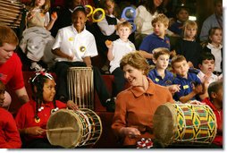 Mrs. Laura Bush joins in a musical number playing a drum with children at the Louisiana Children’s Museum in New Orleans, Tuesday, Jan. 9, 2007, during her visit to see the rebuilding progress in the Gulf Coast region. The museum, closed nearly a year following the 2005 hurricanes, is working to address the needs of young children and families seeking a safe and nurturing environment.  White House photo by Shealah Craighead