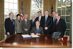 President George W. Bush prepares to sign H.R. 5946, the Magnuson-Stevens Fishery Conservation and Management Reauthorization Act of 2006, Friday, Jan. 12, 2007 in the Oval Office at the White House. President Bush is joined by, from left, Sen. Ted Stevens of Alaska, Sen. Olympia Snow of Maine, Rep. Nick Rahall of West Virginia., Rep. Jim Saxton of New Jersey, Rep. Frank Palloneof New Jersey; Rep. Don Young of Alaska, U.S. Commerce Secretary Carlos Guiterrez and Rep. Wayne Gilchrest of Maryland. White House photo by Paul Morse