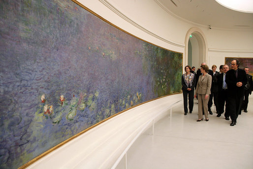 Mrs. Laura Bush tours the Musee de l’Orangerie with Director Pierre Georgel, right, and US Ambassador Craig Stapleton and his wife Mrs. Stapleton, left, in Paris Monday, Jan. 15, 2007. The Musee de l’Orangerie recently underwent renovations and is home to eight paintings from Monet’s large-format series of Water Lilies. White House photo by Shealah Craighead