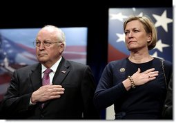 Vice President Dick Cheney stands with Susan Ford Bales, daughter of former President Gerald R. Ford, while the U.S. national anthem is played during the naming ceremony for the new U.S. Navy aircraft carrier, the USS Gerald R. Ford, at the Pentagon in Washington, D.C., Tuesday, Jan. 16, 2007. The nuclear-powered vessel will go into service in 7-8 years and will be the first in the new Gerald R. Ford class of aircraft carriers in the U.S. Navy. White House photo by Paul Morse