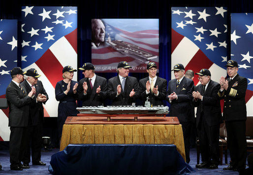 Vice President Dick Cheney, second left, is joined by government officials and family members of former President Gerald R. Ford in applause during a naming ceremony for the new U.S. Navy aircraft carrier, USS Gerald R. Ford, at the Pentagon in Washington, D.C., Tuesday, Jan. 16, 2007. The nuclear-powered aircraft carrier will be the first in the new Gerald R. Ford class of aircraft carriers in the U.S. Navy. Pictured from left to right are Secretary of the Navy Donald Winter, Vice President Dick Cheney, Susan Ford Bales, Steve Ford, Jack Ford, Michael Ford, Senator John Warner, R-Va., Senator Carl Levin D-Mich., and Chief of Naval Operations, Admiral Mike Mullen. White House photo by Paul Morse