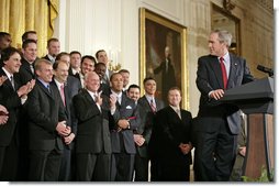 President George W. Bush looks back to MVP David Eckstein during his remarks honoring the St. Louis Cardinals, who won the 2006 World Series Championship, in the East Room Tuesday, Jan. 16, 2007. White House photo by Eric Draper