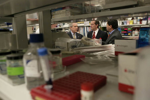 President George W. Bush participates in a tour of a cancer lab at the National Institutes of Health in Bethesda, Md., Wednesday, Jan. 17, 2007. Pictured with the President are Secretary Mike Leavitt, center, and NIH Director Dr. Elias Zerhouni, right. White House photo by Eric Draper
