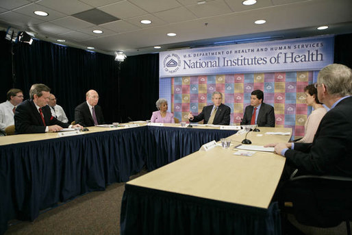 President George W. Bush speaks during a roundtable on cancer prevention at the National Institutes of Health in Bethesda, Md., Wednesday, Jan. 17, 2007. Participants include, from left: Secretary of Health and Human Services Mike Leavitt, NIH Director Dr. John Niederhuber, M.D., Dr. Grace Butler, PhD., NIH Director Dr. Elias Zerhouni, Becky Fisher, and Dr. Francis Collins, M.D., Ph.D. White House photo by Eric Draper