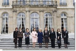 Mrs. Laura Bush stands outside Elysee Palace with other first lady attendees at the Conference on Missing and Exploited Children in Paris Wednesday, Jan. 17, 2007. The conference is hosted by Madame Bernadette Chirac, pictured in the center.  White House photo by Shealah Craighead