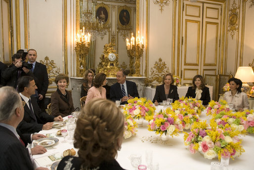 Mrs. Laura Bush attends a luncheon hosted by Madame Bernadette Chirac for the Conference on Missing and Exploited Children at the Elysee Palace in Paris Wednesday, Jan. 17, 2007. President Jacque Chirac of France is pictured in the center. White House photo by Shealah Craighead