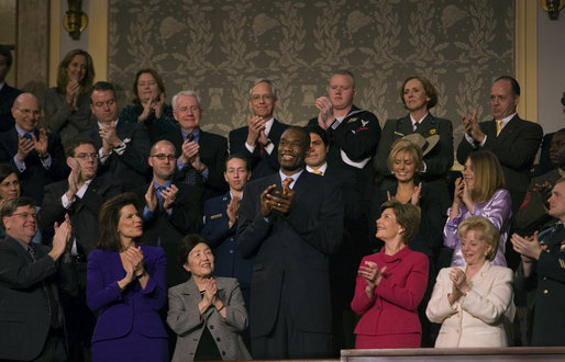 Dikembe Mutombo of the Houston Rockets is recognized by President George W. Bush during the State of the Union Address at U.S. Capitol Tuesday, Jan. 23, 2007. "Dikembe became a star in the NBA, and a citizen of the United States," said President Bush. "But he never forgot the land of his birth, or the duty to share his blessings with others. He built a brand new hospital in his old hometown. A friend has said of this good-hearted man: "Mutombo believes that God has given him this opportunity to do great things." And we are proud to call this son of the Congo a citizen of the United States of America." White House photo by Eric Draper