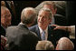 President George W. Bush greets people, shakes hands and signs his autograph after delivering the State of the Union Address in the House Chamber at the U.S. Capitol Tuesday, Jan. 23, 2007. White House photo by Paul Morse