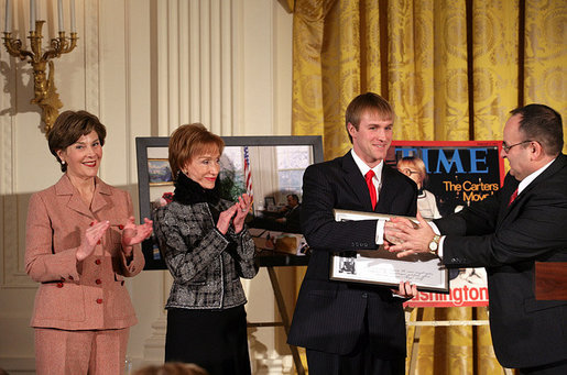 Fred Love, a journalism student at Iowa State University, is presented the Hugh S. Sidey Scholarship in print journalism in the East Room Friday, Jan. 26, 2007. The scholarship is named for Time Magazine correspondent Hugh Sidey. White House photo by Shealah Craighead