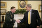 President George W. Bush welcomes Army General David Petraeus, incoming Commander of the Multi-National Force-Iraq, Friday, Jan. 26, 2007, to the Oval Office. White House photo by Eric Draper
