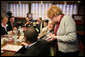 President George W. Bush speaks with a waitress taking his breakfast order Tuesday morning, Jan. 30, 2007, during a breakfast meeting with small business leaders at The Sterling Family Restaurant in Peoria, Ill. White House photo by Paul Morse
