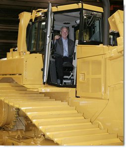 President George W. Bush inspects the driver’s compartment of a large Caterpillar bulldozer during a tour of the Caterpillar Inc. facility Tuesday, Jan. 30, 2007, in East Peoria, Ill., where President Bush addressed workers at the plant about the strength and growth of the U.S. economy.  White House photo by Paul Morse