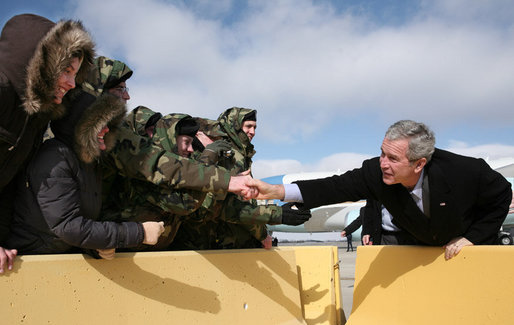 President George W. Bush reaches to shake hands and greet members of the Illinois Air National Guard and their families Tuesday, Jan. 30, 2007, prior to leaving Peoria, Ill. White House photo by Paul Morse