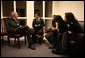 President George W. Bush meets with the family of Cesar Borja, a 20-year veteran of the New York Police Department, who died Jan. 23, 2007, of lung disease. With the President from left is Ceasar Borja Jr., 21; Nhia Borja, 12; Evan Borja, 16, and Officer Borja's wife, Eva Borja. The meeting came during the President's visit to New York City's Freedom Hall Wednesday, Jan. 31, 2007. White House photo by Paul Morse