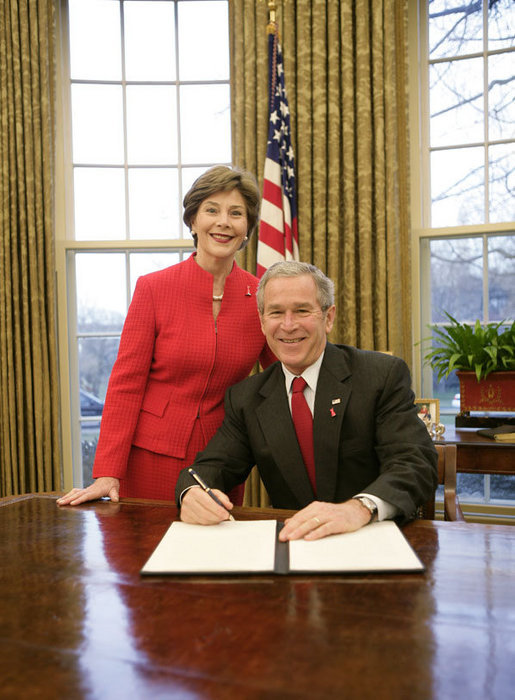 President George W. Bush is joined by Mrs. Laura Bush in the Oval Office at the White House, Thursday, Feb. 1, 2007, as President Bush prepares to sign the Presidential Proclamation in honor of American Heart Month. American Heart Month encourages Americans to take actions that reduce their risk and increase awareness of heart disease. White House photo by Eric Draper