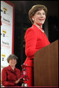 Mrs. Laura Bush accepts the Woman's Day Magazine Red Dress Award in New York, NY for her leadership in raising awareness of women's heart disease, February 1, 2007, as Jane Chestnutt, Editor in Chief of Woman's Day, looks on. White House photo by Shealah Craighead