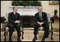 President George W. Bush and Amine Gemayel, former President of Lebanon, talk with reporters in the Oval Office Thursday, Feb. 8, 2007, during Gemayel's visit to the White House. White House photo by Paul Morse