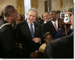 President George W. Bush meets with New York City subway hero Wesley Autrey, left, and members of the Autrey family, in the East Room of the White House, Monday, Feb. 12, 2007, during the celebration of African American History Month. White House photo by Eric Draper