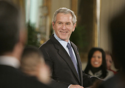 President George W. Bush welcomes guests to the East Room of the White House, Monday, Feb. 12, 2007, for the celebration of African American History Month. White House photo by Paul Morse