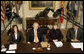 President George W. Bush, joined by Mrs. Laura Bush, talks with reporters during a briefing on volunteerism in the Roosevelt Room at the White House, Tuesday, Feb. 13, 2007, seen with Jean Case, chair of the President�s Council on Service and Civic Participation, and Bob Goodwin, president and CEO of Points of the Light Foundation and Volunteer Center National Network.  White House photo by Eric Draper