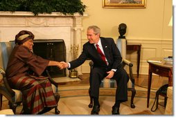 President George W. Bush greets Liberia's President Ellen Johnson-Sirleaf during her visit Wednesday, Feb. 14, 2007, to the White House. President Bush applauded the leader's confidence and deep concern for the people of Liberia, saying, "I thank you very much for setting such a good example for not only the people of Liberia, but for the people around the world, that new democracies have got the capability of doing the hard work necessary to rout out corruption, to improve the lives of the citizens with infrastructure projects that matter."  White House photo by Shealah Craighead
