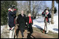 President George W. Bush is escorted by Gay Hart Gaines, Regent of the Mount Vernon Ladies Association, as President Bush and Mrs. Laura Bush arrive Monday, Feb. 19, 2007 to the Mount Vernon Estate in Mount Vernon, Va., to lay a wreath at the tomb of President George Washington in honor of Washington’s 275th birthday. White House photo by Eric Draper