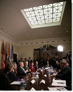 President George W. Bush talks to reporters during a meeting on health care initiatives in the Roosevelt Room at the White House, Tuesday, Feb. 20, 2007.  White House photo by Eric Draper