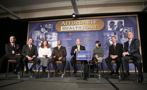 President George W. Bush answers a question from the audience at a forum on health care initiatives Wednesday, Feb. 21, 2007, at the Chattanooga Convention Center in Chattanooga, Tenn. President Bush is joined by panelist, from left to right, U.S. Sec. of Health and Human Services Michael O. Leavitt, Dr. Joseph Cofer, Martha Ginn, Will Smith, Amy Childers, Danny Jennings and Governor Phil Bredesen. White House photo by Paul Morse
