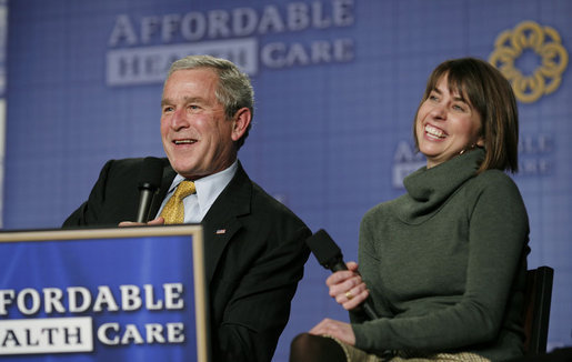 President George W. Bush and panelist Amy Childers react to an audience members question during a forum discussion on health care initiatives Wednesday, Feb. 21, 2007, at the Chattanooga Convention Center in Chattanooga, Tenn. White House photo by Paul Morse