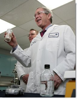 President George W. Bush holds a jar of spruce wood chips during a tour of the labs at Novozymes North America, Inc., Thursday, Feb. 22, 2007 in Franklinton, N.C., during a demonstration on how cellulosic ethanol can be produced from bio mass materials. White House photo by Paul Morse