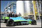 President George W. Bush is joined by officials from Novozymes North America, Inc. Wednesday, Feb. 22, 2007, as he is shown a race car that is fueled by ethanol, during his tour of the Novozymes, a biotechnology facility in Franklinton, N.C. White House photo by Paul Morse