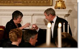 President George W. Bush offers a toast to Arizona Governor Janet Napolitano at the White House Sunday evening, Feb. 25, 2007, during the State Dinner in honor of the Nation’s Governors.  White House photo by Shealah Craighead