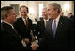 President George W. Bush shakes hands with Nebraska Governor Dave Heineman, left, joined by New York Governor Eliot Spitzer, center and Gov. Mike Easley of North Carolina, following a meeting with the National Governors Association in the State Dining Room of the White House, Monday, Feb. 26, 2007. White House photo by Eric Draper