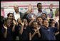 President George W. Bush with New Orleans Mayor Ray Nagin, left, and Dr. Anthony “Tony” Recasner, principal and director of the Samuel J. Green charter school, pose with third grade students for a photo Thursday, March 1, 2007, during President Bush’s visit to the Gulf Coast region to see the continued recovery progress of communities devastated by Hurricane Katrina. White House photo by Eric Draper
