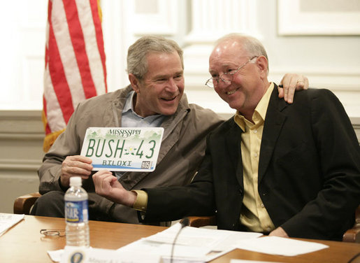 President George W. Bush is presented with a license plate with his name and the number 43 from Biloxi, Miss., Mayor A. J. Holloway, during a meeting Thursday, March 1, 2007 in Biloxi, on the recovery and reconstruction efforts underway in the region devastated by Hurricane Katrina. White House photo by Eric Draper