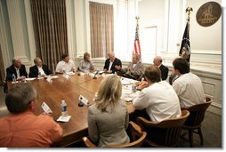 President George W. Bush is joined by Mississippi Governor Haley Barbour, left, and Biloxi, Miss., Mayor A. J. Holloway, right, during a meeting with local leaders Thursday, March 1, 2007 in Biloxi, on the recovery and reconstruction efforts underway in the region devastated by Hurricane Katrina.  White House photo by Eric Draper