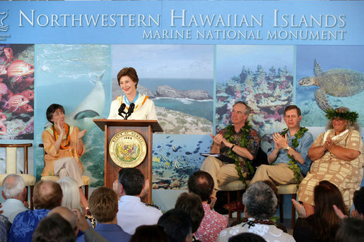 Mrs. Laura Bush is applauded by Hawaiian Gov. Linda Lingle, left, at the Northwest Hawaiian Islands Marine National Monument Naming Ceremony, Friday, March 2, 2007 in Honolulu, where Laura Bush unveiled the new Hawaiian name as the Papahanaumokuakea Marine National Monument. The Northwestern Monument represents the largest single conservation area in our nation's history and the largest protected marine area in the world. White House photo by Shealah Craighead