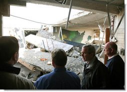 President George W. Bush walks through tornado damage at Enterprise High School in Enterprise, Ala., Saturday, March 3, 2007. The President visited people affected by storms in Americus, Ga., and Enterprise, Ala. White House photo by Paul Morse