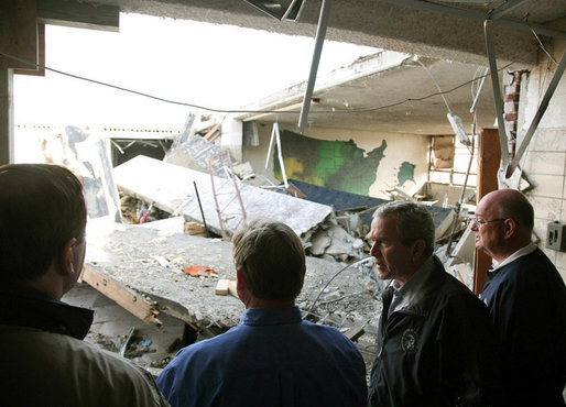 President George W. Bush walks through tornado damage at Enterprise High School in Enterprise, Ala., Saturday, March 3, 2007. The President visited people affected by storms in Americus, Ga., and Enterprise, Ala. White House photo by Paul Morse